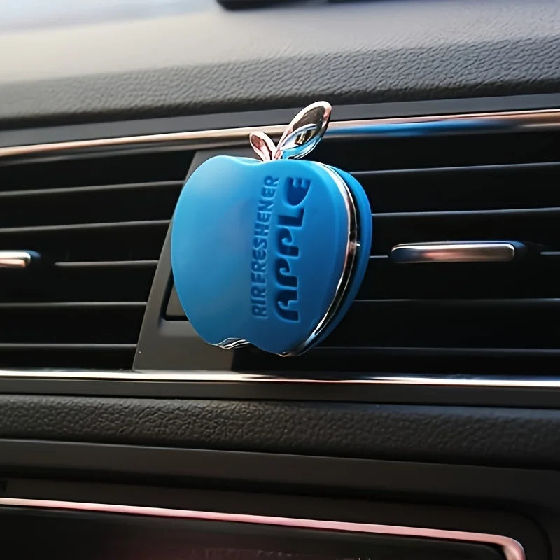 An apple-shaped car air freshener with floral fragrance - featuring a decorative ventilation clip design