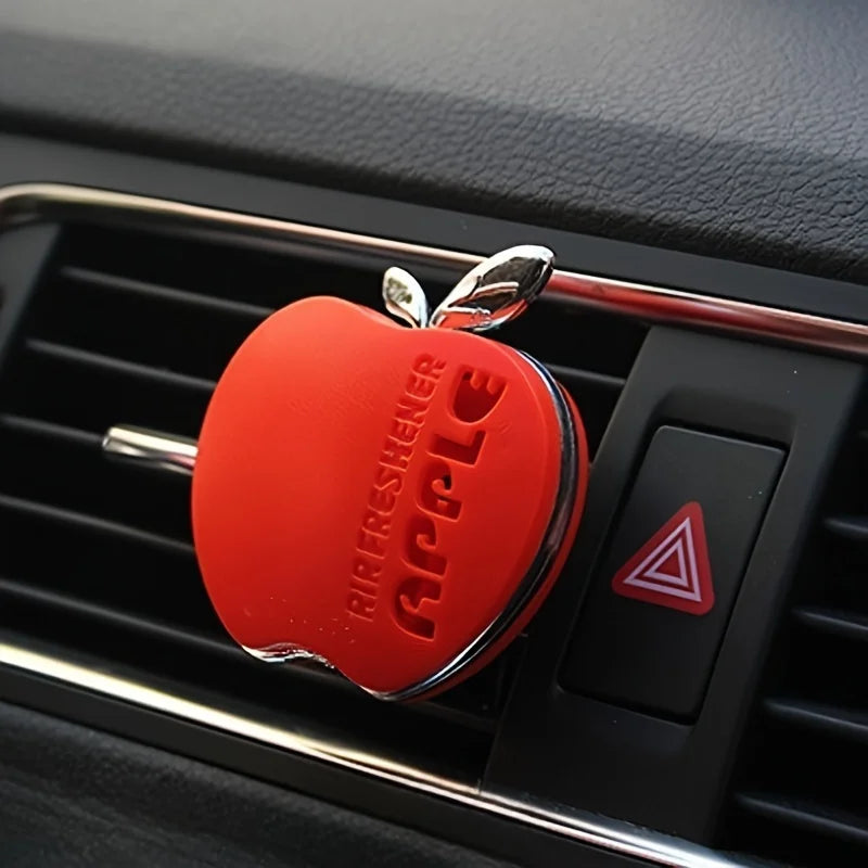 An apple-shaped car air freshener with floral fragrance - featuring a decorative ventilation clip design