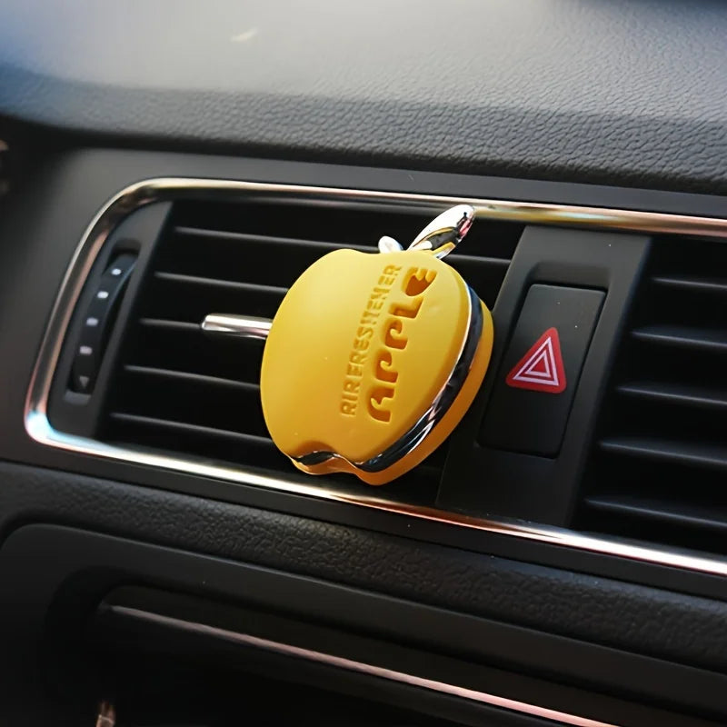 An apple-shaped car air freshener with floral fragrance - featuring a decorative ventilation clip design